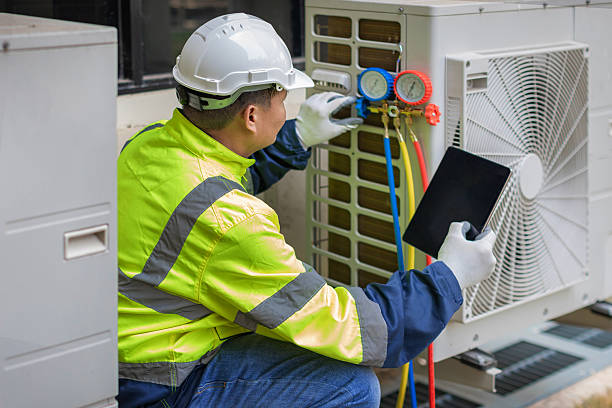 Professional Air Conditioning Repair technician working in Kettlersville, OH